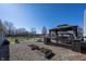 Backyard featuring a gazebo, landscaping, and a pond at 1471 S Frog Pond Ct, Greenfield, IN 46140