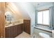 Bathroom with updated vanity, granite countertop, modern sink, and ample sunlight at 1471 S Frog Pond Ct, Greenfield, IN 46140