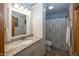 Bathroom featuring white cabinets, granite countertop, and shower with curtain at 1471 S Frog Pond Ct, Greenfield, IN 46140