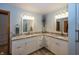 Bright bathroom with dual sinks, granite countertops, and ample cabinet space at 1471 S Frog Pond Ct, Greenfield, IN 46140