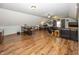 Open-concept bonus room with a bar, office area, and comfortable seating at 1471 S Frog Pond Ct, Greenfield, IN 46140