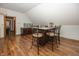 This bonus room features wood floors, a snack bar with stone countertops, and seating for five at 1471 S Frog Pond Ct, Greenfield, IN 46140