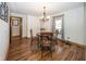 Cozy dining room featuring hardwood floors, ample storage, and a chandelier at 1471 S Frog Pond Ct, Greenfield, IN 46140