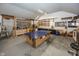A garage space with storage and a ping pong table at 1471 S Frog Pond Ct, Greenfield, IN 46140