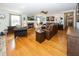 Bright living room with hardwood floors, a fireplace, and large windows providing ample natural light at 1471 S Frog Pond Ct, Greenfield, IN 46140
