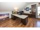 Functional office space featuring a large desk and wood floors at 1471 S Frog Pond Ct, Greenfield, IN 46140