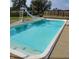 Backyard pool featuring a slide, diving board and beautiful concrete surround with privacy fence at 1471 S Frog Pond Ct, Greenfield, IN 46140