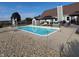 Backyard pool and entertaining area featuring a pergola, lounge chairs and privacy fence at 1471 S Frog Pond Ct, Greenfield, IN 46140