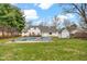 Spacious backyard featuring a pool, deck, shed, and well-maintained lawn at 1707 Rocky Ford Rd, Columbus, IN 47203