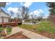 Expansive backyard with a deck, pool, shed, and mature trees at 1707 Rocky Ford Rd, Columbus, IN 47203