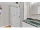 Bathroom featuring a glass door shower, and a marble countertop sink at 1707 Rocky Ford Rd, Columbus, IN 47203