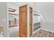 View from landing doorway to a bathroom with black and white striped shower curtain at 1707 Rocky Ford Rd, Columbus, IN 47203