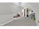Bedroom has carpet floors, neutral paint, storage area, and angled ceilings at 1707 Rocky Ford Rd, Columbus, IN 47203
