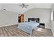 Bedroom with hardwood floors, neutral paint, modern ceiling fan, and a closet at 1707 Rocky Ford Rd, Columbus, IN 47203