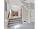 Hallway leading to updated kitchen, featuring modern floors, neutral paint, and an abundance of light at 1707 Rocky Ford Rd, Columbus, IN 47203