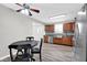 Bright kitchen featuring stainless steel appliances, wood cabinets, and an adjacent dining table at 1707 Rocky Ford Rd, Columbus, IN 47203