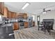 Well-lit kitchen with stainless steel appliances, wood cabinetry, and a dining area at 1707 Rocky Ford Rd, Columbus, IN 47203