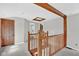 Spacious landing with wood trim and carpet flooring, provides access to the bedroom and bathroom at 1707 Rocky Ford Rd, Columbus, IN 47203