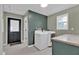 Convenient laundry room with modern appliances, lots of counter space and natural light at 1707 Rocky Ford Rd, Columbus, IN 47203