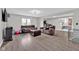 Cozy living room with modern flooring, lots of space, and a large window providing plenty of light at 1707 Rocky Ford Rd, Columbus, IN 47203