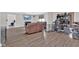Spacious living room with hardwood floors, neutral paint, and access to other rooms at 1707 Rocky Ford Rd, Columbus, IN 47203