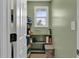 Walk-in pantry providing ample storage space with shelving and a window for natural light at 1707 Rocky Ford Rd, Columbus, IN 47203