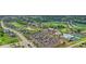 Aerial view of a community with a pool, tennis courts, clubhouse, and lush green landscaping at 20598 Chatham Creek Dr, Westfield, IN 46074
