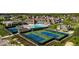 A high angle view of the community clubhouse featuring a pool, and tennis courts and upscale architecture at 20598 Chatham Creek Dr, Westfield, IN 46074