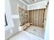 Unfinished bathroom featuring an open shower, bench seat and exposed plumbing at 20598 Chatham Creek Dr, Westfield, IN 46074