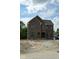 New two-story brick home featuring large windows and an arched front entry at 20598 Chatham Creek Dr, Westfield, IN 46074