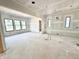 Unfinished living room featuring a doorway to another room and natural light from the backyard at 20598 Chatham Creek Dr, Westfield, IN 46074
