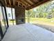Covered outdoor patio featuring a brick fireplace and view of the backyard space at 20598 Chatham Creek Dr, Westfield, IN 46074