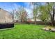 Expansive backyard with a hot tub, lush lawn, mature trees, and ' play area at 2180 Olympia Dr, Franklin, IN 46131