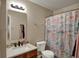 Bathroom featuring a sink, toilet, and tub with a colorful shower curtain at 2180 Olympia Dr, Franklin, IN 46131