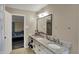 This bathroom features a double vanity with white cabinets, granite countertops, and a large mirror at 2180 Olympia Dr, Franklin, IN 46131