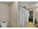 The bathroom has a white toilet, and shower/tub combination with a decorative curtain at 2180 Olympia Dr, Franklin, IN 46131
