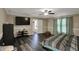This bright bedroom features a ceiling fan, a TV, and a doorway to another room at 2180 Olympia Dr, Franklin, IN 46131