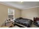 This bedroom features natural light, a bedside table, a dresser, and a comfortable bed at 2180 Olympia Dr, Franklin, IN 46131