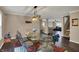 Charming dining room featuring a glass table, unique chairs, and an inviting chandelier at 2180 Olympia Dr, Franklin, IN 46131