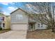 Charming two-story home with a well-maintained lawn, two car garage, and inviting front porch at 2180 Olympia Dr, Franklin, IN 46131