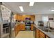 Traditional kitchen with stainless appliances, wood cabinets, and a double basin sink at 2180 Olympia Dr, Franklin, IN 46131