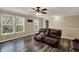 Bright living room featuring hardwood floors and comfortable leather reclining sofa at 2180 Olympia Dr, Franklin, IN 46131
