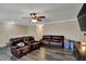 Spacious living room with hardwood floors and comfortable reclining sofas at 2180 Olympia Dr, Franklin, IN 46131