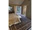 Bedroom with a patterned rug leads to the ensuite bathroom with a luxurious tub at 2872 Jeremy Ct, Carmel, IN 46033