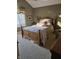 Charming bedroom with a wood-frame bed and a decorative window treatment at 2872 Jeremy Ct, Carmel, IN 46033