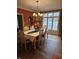 Formal dining room with hardwood floors and elegant chandelier lighting at 2872 Jeremy Ct, Carmel, IN 46033