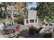 An outdoor stone fireplace and patio seating creates the perfect outdoor living space at 2872 Jeremy Ct, Carmel, IN 46033