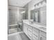 Sleek bathroom features a glass-enclosed shower with a bench and double sink vanity at 3124 Sharon Cir, Brownsburg, IN 46112