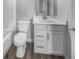Cozy bathroom with tiled floors features a sink vanity and toilet, combining style and functionality at 3124 Sharon Cir, Brownsburg, IN 46112