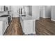 Modern kitchen features stainless steel appliances, white cabinets, subway tile backsplash, and wood flooring at 3124 Sharon Cir, Brownsburg, IN 46112